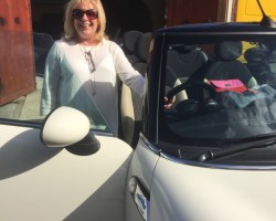 The very glamorous Irene chose this 2009 MINI Cooper Convertible in Pepper White with low miles 35K & Half White Leather Interior