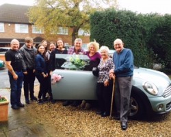 A Surprise Birthday Present for Donna – Behind this family  is a 2011 MINI One 1.6 in Ice Blue