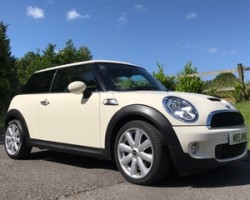 Mike chose this 2009 / 59 MINI Cooper S with Chili & Visibility Packs in Pepper White with Low Miles 26K & 1 Owner