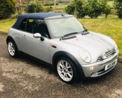 Howard and Beverley chose this 2007 / 57 MINI Cooper Convertible in Pure Silver with Blue Hood & Full Leather Heated Sports Seats