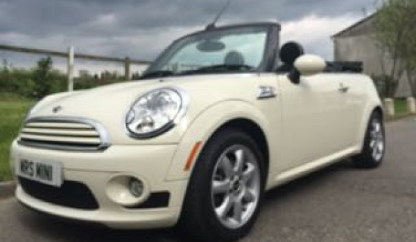 Kerry is having this 2009 / 59 MINI Cooper Convertible Chili & Visibility Packs with Sports Bodykit In Pepper White with Lounge Leather