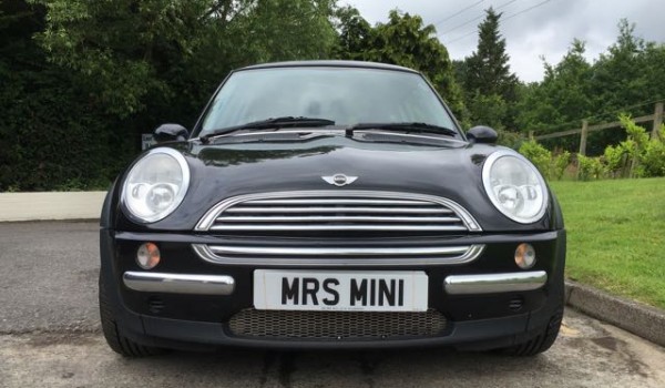 Susan is the lucky lady being treated to this 2004 MINI Cooper Pepper Pack in Astro Black with Sunroof