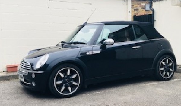 Alex & family has chosen this 2008 MINI Cooper Sidewalk in Black with LOW MILES & Heated Seats