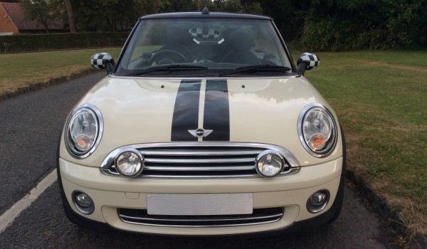 The very glamorous Irene chose this 2009 MINI Cooper Convertible in Pepper White with low miles 35K & Half White Leather Interior