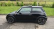 Susan is the lucky lady being treated to this 2004 MINI Cooper Pepper Pack in Astro Black with Sunroof