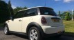 The Lovely Sammy & her partner seem pleased with their 2009 / 59 MINI ONE 1.4 IN PEPPER WHITE – with Air Con & Alloys