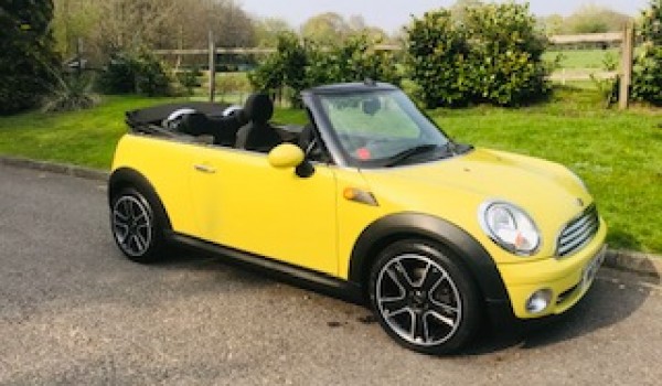 Sharron & Nigel chose this 2009 / 59 MINI Cooper Convertible in Interchange Yellow with Service History & Low Miles