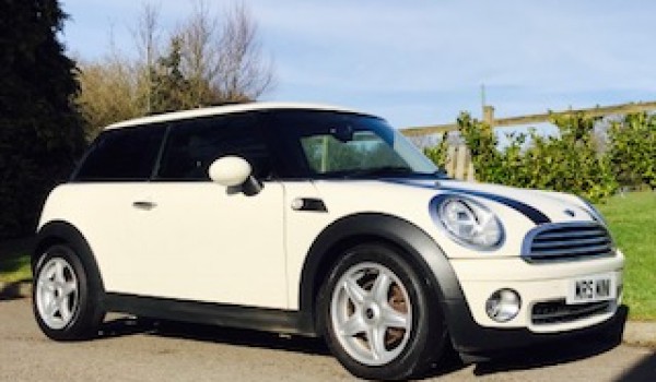 Helen & John have chosen this 2010 MINI Cooper Chili AUTOMATIC with SUNROOF & Half Red Leather Sports Seats