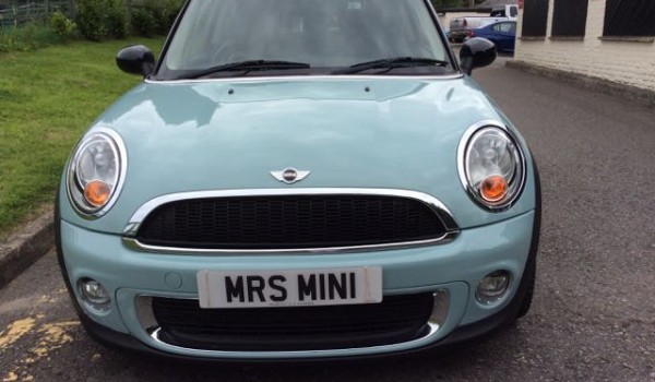 Tamara’s lovely family embracing their MINI called “Vanilla Ice Baby”  a 2010 MINI Cooper Chili In Ice Blue with Low Miles 14700 & Full Leather Seats