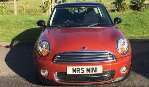 Diane has chosen this 2010 MINI Cooper Spice Orange With Chili Pack & Ridiculously Low Miles 20K