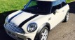 Helen & John have chosen this 2010 MINI Cooper Chili AUTOMATIC with SUNROOF & Half Red Leather Sports Seats