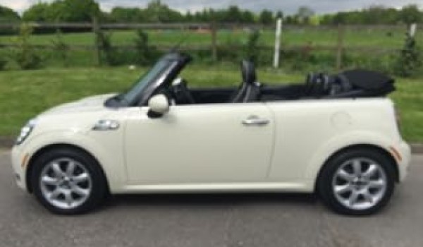 Kerry is having this 2009 / 59 MINI Cooper Convertible Chili & Visibility Packs with Sports Bodykit In Pepper White with Lounge Leather