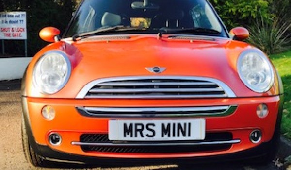 Heidi chose this 2006 MINI Cooper Convertible in Hot Orange with FULL SERVICE HISTORY
