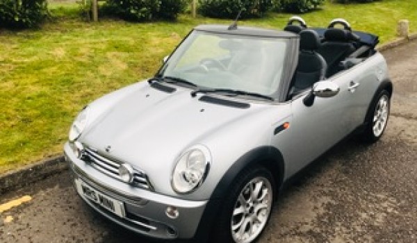 Howard and Beverley chose this 2007 / 57 MINI Cooper Convertible in Pure Silver with Blue Hood & Full Leather Heated Sports Seats