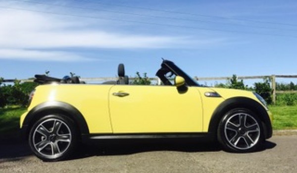 Mike chose this 2009 MINI Cooper S in Interchange Yellow – with RIDICULOUSLY LOW MILES 27K