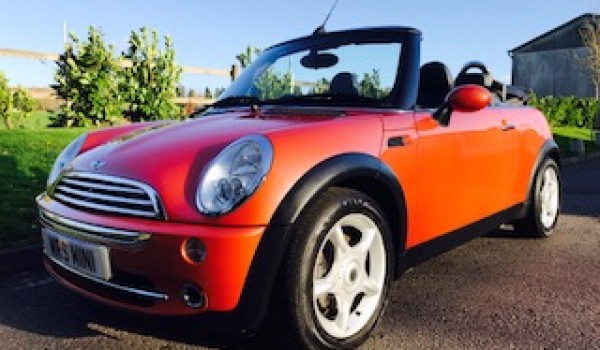 Heidi chose this 2006 MINI Cooper Convertible in Hot Orange with FULL SERVICE HISTORY