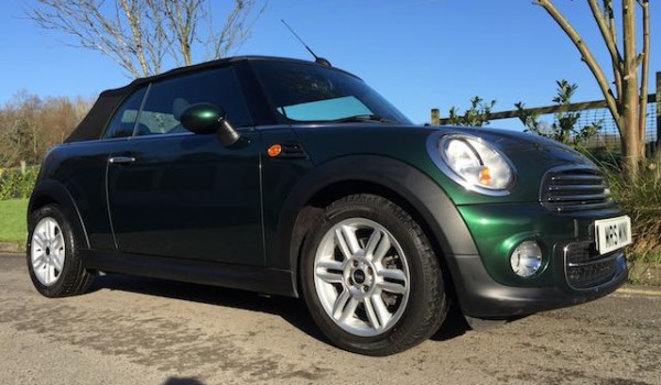 Georgia is having this 2012 MINI Cooper Convertible in British Racing Green & 14K miles Called “HOT PANTS”